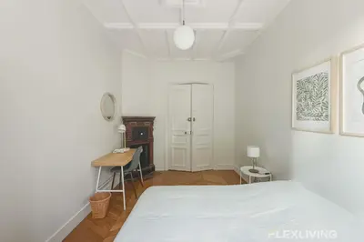 Un ou plusieurs lits dans un hébergement de l'établissement Cozy Room in Alésia Paris 14th