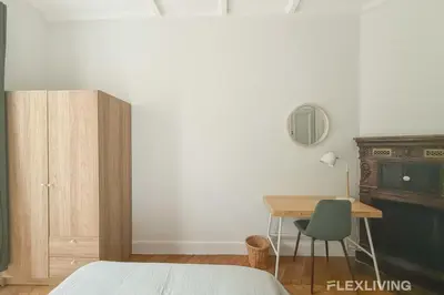 Un ou plusieurs lits dans un hébergement de l'établissement Cozy Room in Alésia Paris 14th