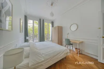Un ou plusieurs lits dans un hébergement de l'établissement Cozy Room in Alésia Paris 14th