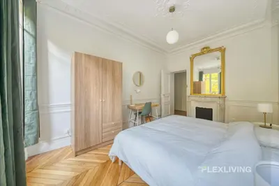 Un ou plusieurs lits dans un hébergement de l'établissement Cozy Room in Alésia Paris 14th