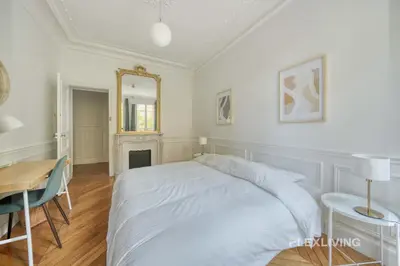 Un ou plusieurs lits dans un hébergement de l'établissement Cozy Room in Alésia Paris 14th