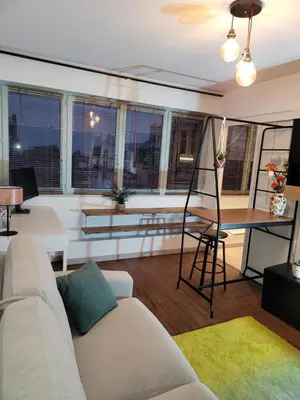Coin salon dans l'établissement Studio cosy 21m2 rénové 75019