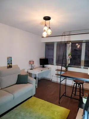 Coin salon dans l'établissement Studio cosy 21m2 rénové 75019