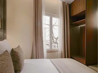 Un ou plusieurs lits dans un hébergement de l'établissement Merveil - Signature Suite - Champs Elysees - Dulud I