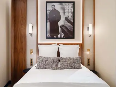 Un ou plusieurs lits dans un hébergement de l'établissement Merveil - Signature Suite - Champs Elysees - Dulud I