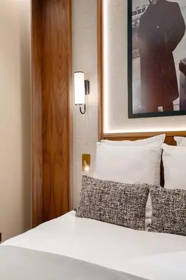 Un ou plusieurs lits dans un hébergement de l'établissement Merveil - Signature Suite - Champs Elysees - Dulud I