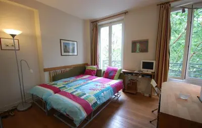 Un ou plusieurs lits dans un hébergement de l'établissement Studio Paris near Invalides Unesco Eiffel Tower Montparnasse