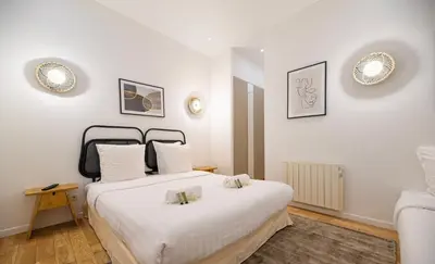 Un ou plusieurs lits dans un hébergement de l'établissement CIA - Notre Dame spacious Home