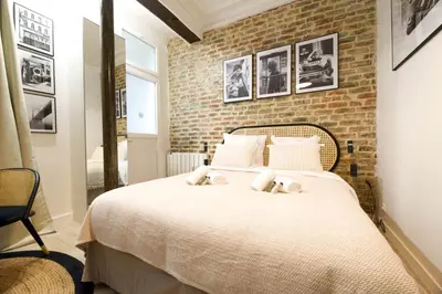 Un ou plusieurs lits dans un hébergement de l'établissement CIA - Faubourg Montmartre Studio