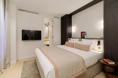 Un ou plusieurs lits dans un hébergement de l'établissement Oniri - Serviced Apartments Notre Dame - Quai des Grands Augustins