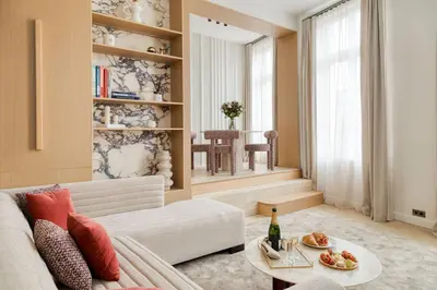 Coin salon dans l'établissement Oniri - Serviced Apartments Notre Dame - Quai des Grands Augustins
