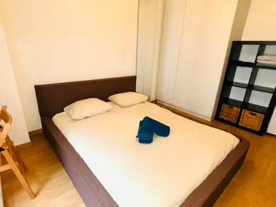 Un ou plusieurs lits dans un hébergement de l'établissement Appartement Tour Eiffel ALESIA PARIS