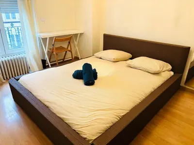 Un ou plusieurs lits dans un hébergement de l'établissement Appartement Tour Eiffel ALESIA PARIS