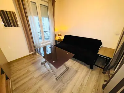 Coin salon dans l'établissement Appartement Tour Eiffel ALESIA PARIS