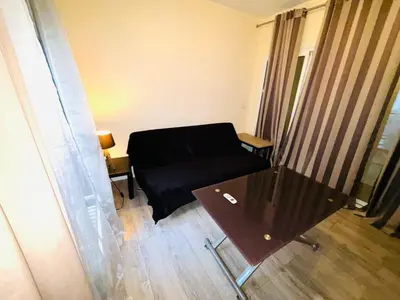 Coin salon dans l'établissement Appartement Tour Eiffel ALESIA PARIS