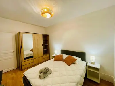 Un ou plusieurs lits dans un hébergement de l'établissement Appartement Maridor Porte de Versailles Paris