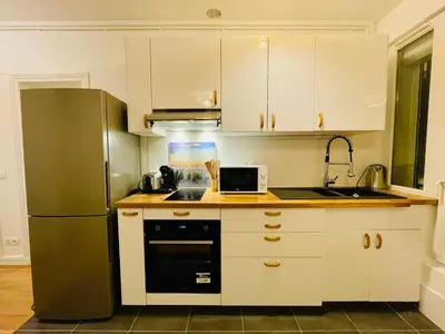 Cuisine ou kitchenette dans l'établissement Appartement Maridor Porte de Versailles Paris