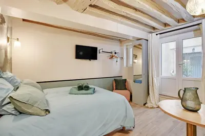 Un ou plusieurs lits dans un hébergement de l'établissement Cozy studio in Le Marais - fully equipped