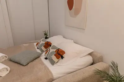 Un ou plusieurs lits dans un hébergement de l'établissement MBA - Courcelles - Splendide Appartement