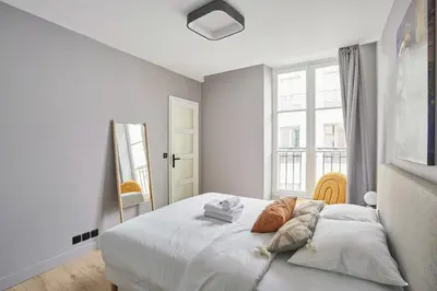 Un ou plusieurs lits dans un hébergement de l'établissement Charming apartment 1BR - Montorgueil-Sentier
