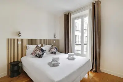 Un ou plusieurs lits dans un hébergement de l'établissement Pick A Flat's Apartments in Madeleine - Rue Tronchet