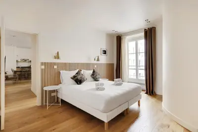 Un ou plusieurs lits dans un hébergement de l'établissement Pick A Flat's Apartments in Madeleine - Rue Tronchet