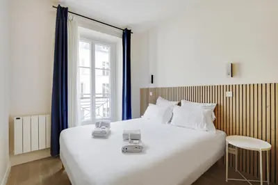 Un ou plusieurs lits dans un hébergement de l'établissement Pick A Flat's Apartments in Madeleine - Rue Tronchet