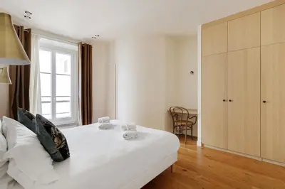 Un ou plusieurs lits dans un hébergement de l'établissement Pick A Flat's Apartments in Madeleine - Rue Tronchet