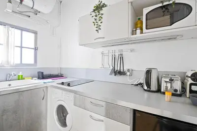 Cuisine ou kitchenette dans l'établissement Superb Apartment Quartier Les Marais Free Netflix