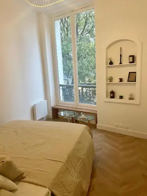 Un ou plusieurs lits dans un hébergement de l'établissement Mona Lisa - Residences Paris Heart of Paris