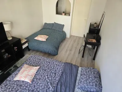 Un ou plusieurs lits dans un hébergement de l'établissement Cosy Studio Close Eiffel Tower