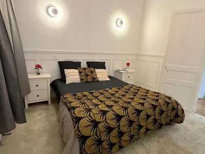 Un ou plusieurs lits dans un hébergement de l'établissement L'appartement Moliteuil