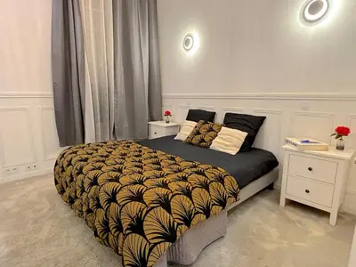 Un ou plusieurs lits dans un hébergement de l'établissement L'appartement Moliteuil
