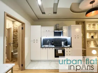 Cuisine ou kitchenette dans l'établissement Urban Flat - 196 Saint Honore