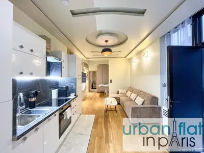 Cuisine ou kitchenette dans l'établissement Urban Flat - 196 Saint Honore