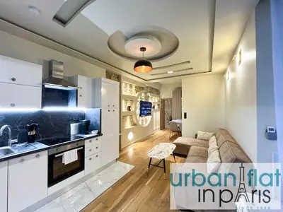 Cuisine ou kitchenette dans l'établissement Urban Flat - 196 Saint Honore