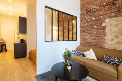 Coin salon dans l'établissement Cozy Apartment in heart of Montmartre