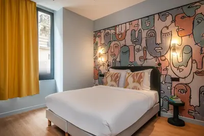 Un ou plusieurs lits dans un hébergement de l'établissement Montmartre Paris Suite