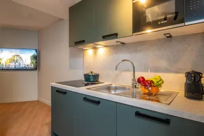 Cuisine ou kitchenette dans l'établissement Montmartre Paris Suite
