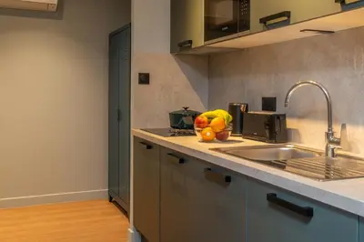Cuisine ou kitchenette dans l'établissement Montmartre Paris Suite