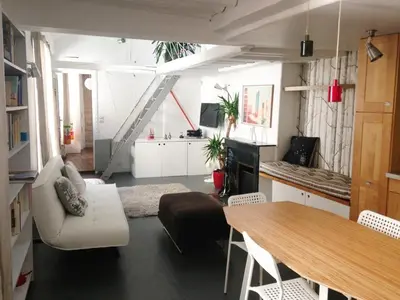 Coin salon dans l'établissement Charming 2-bedroom duplex Bastille
