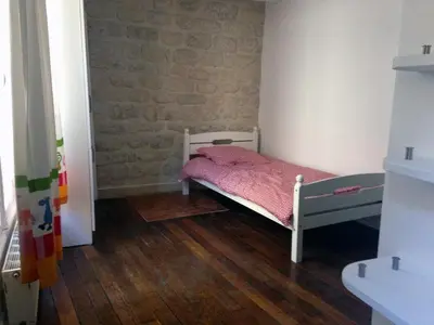 Un ou plusieurs lits dans un hébergement de l'établissement Charming 2-bedroom duplex Bastille