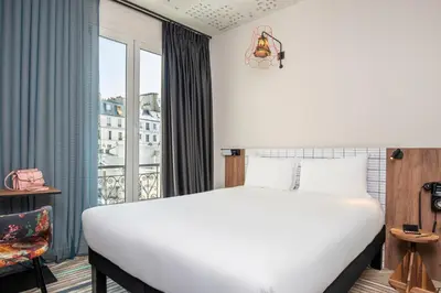 Un ou plusieurs lits dans un hébergement de l'établissement Ibis Styles Hotel Paris Gare de Lyon Bastille