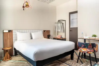 Un ou plusieurs lits dans un hébergement de l'établissement Ibis Styles Hotel Paris Gare de Lyon Bastille