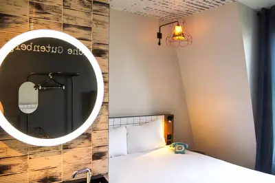 Un ou plusieurs lits dans un hébergement de l'établissement Ibis Styles Hotel Paris Gare de Lyon Bastille