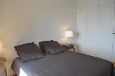 Un ou plusieurs lits dans un hébergement de l'établissement Appartement moulin rouge II