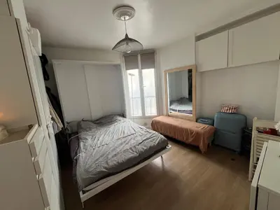 Un ou plusieurs lits dans un hébergement de l'établissement Appartement le menilmontant