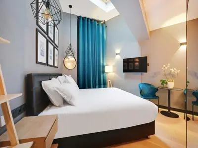 Un ou plusieurs lits dans un hébergement de l'établissement Charming studio -2P- Auteuil