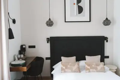 Un ou plusieurs lits dans un hébergement de l'établissement Hôtel des Beaux Arts