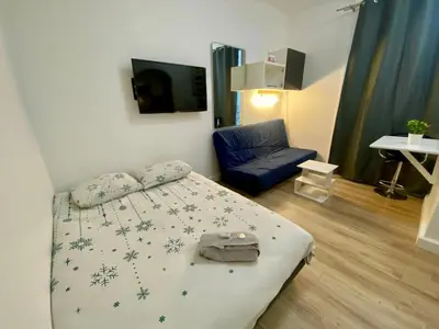 Un ou plusieurs lits dans un hébergement de l'établissement Studio Convention Porte de Versailles